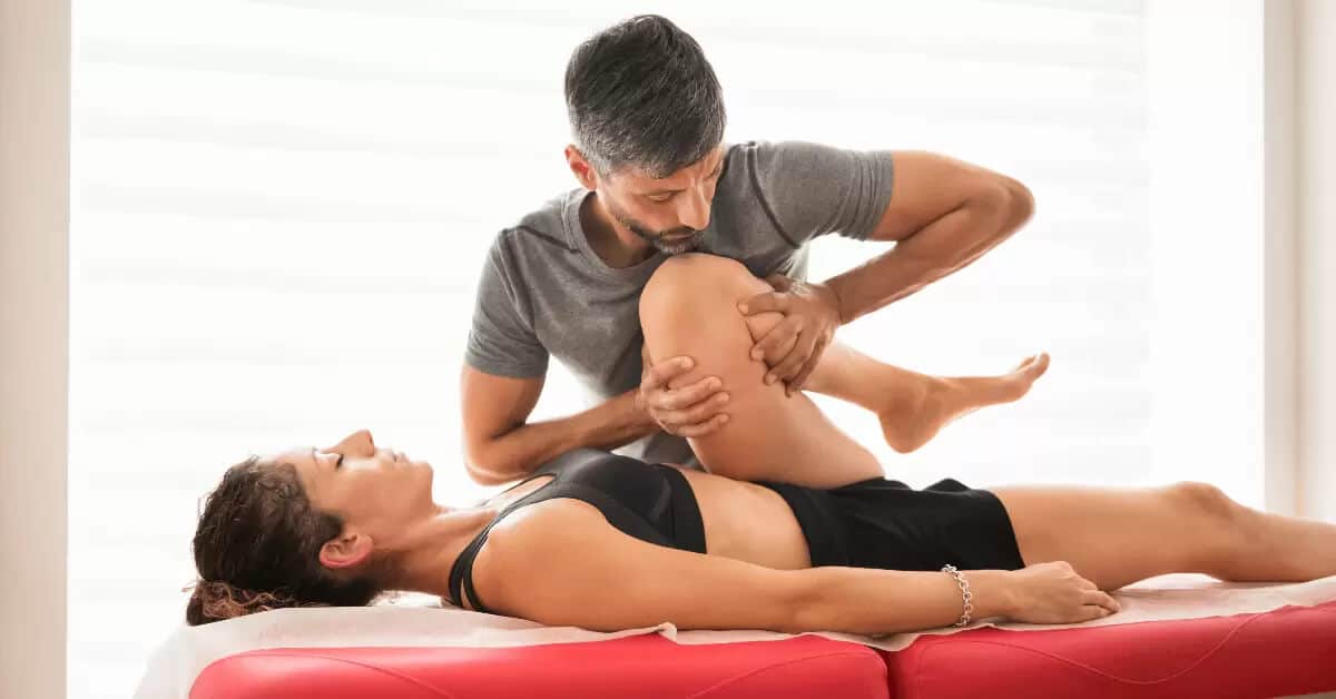Osteopath doing a hip mobility evaluation